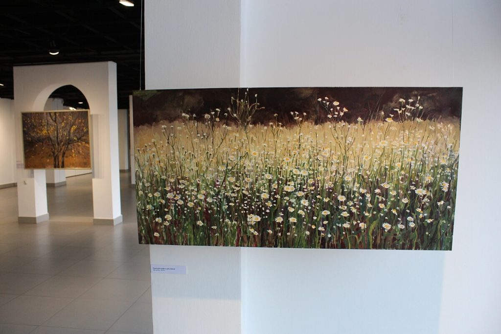 Obraz Aleksandry Rey prezentujące kwiaty na łące
